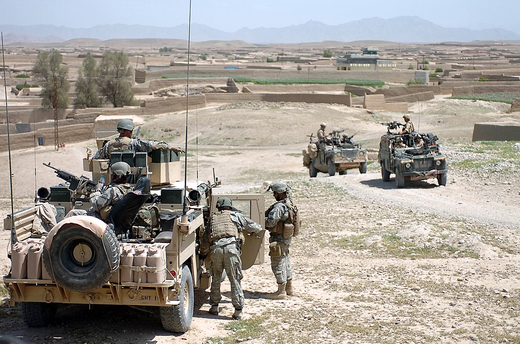 U.S. and British Army Soldiers take a tactical pause during a combat patrol in the Sangin District area of Helmand Province, Afghanistan, April 10, 2007..(U.S. Army photo by Spc. Daniel Love) (Released)..