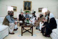 Reagan sitting with Afghan Mujahideen - Public Domain